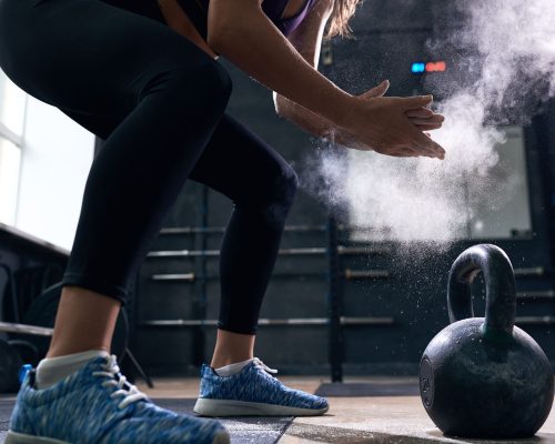 young-woman-lifting-kettlebells-in-crossfit-gym-min.jpg young-woman-lifting-kettlebells-in-crossfit-gym-min.jpg
